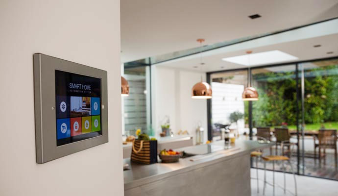 A close-up view of a wall-mounted smart home automation control panel