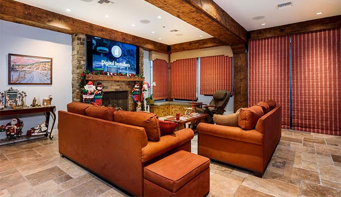 A modern living lounge featuring a wall-mounted flat screen television
