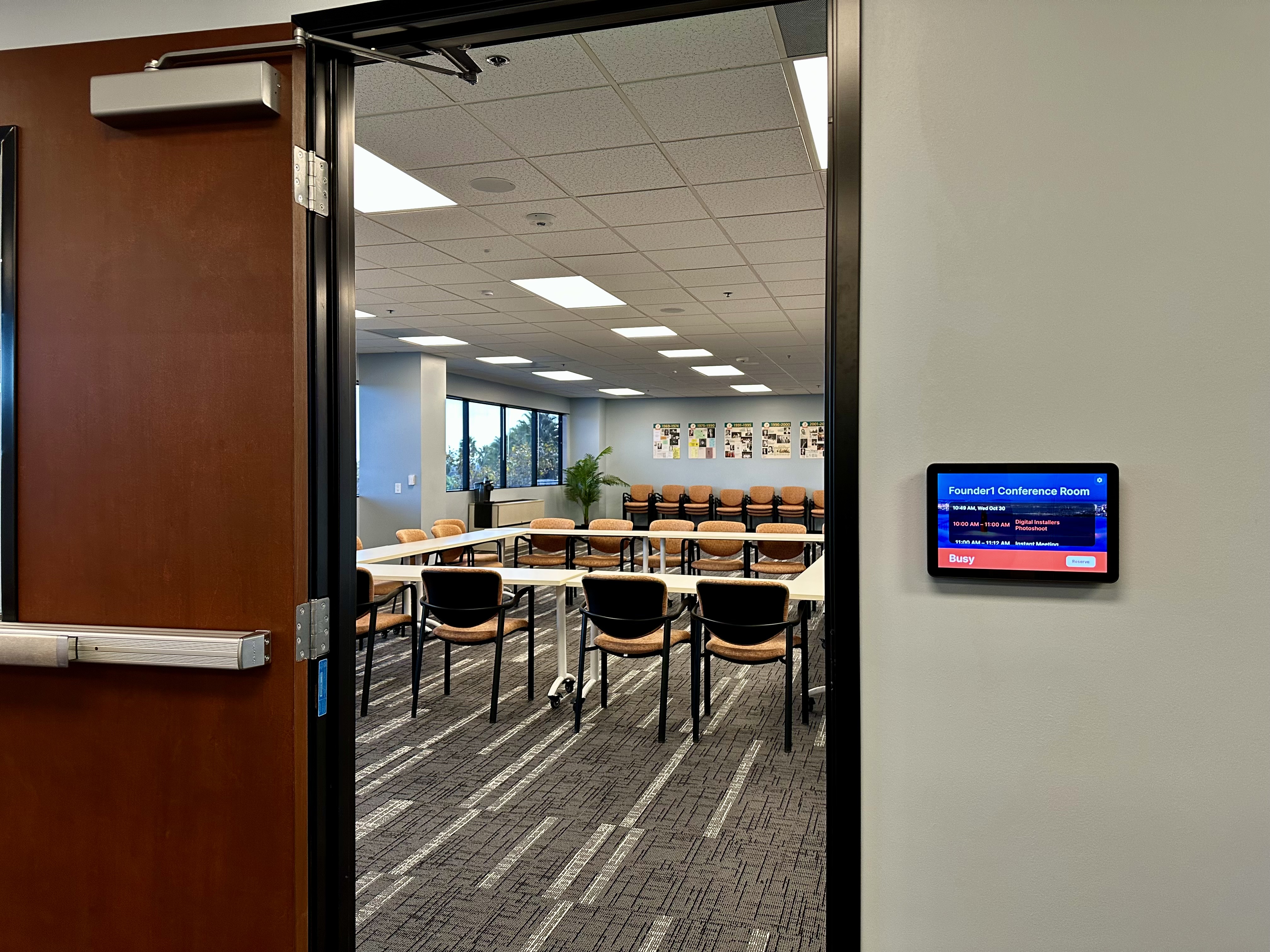 Logitech touchscreen provided by YMCA, specifically used for managing room reservations.