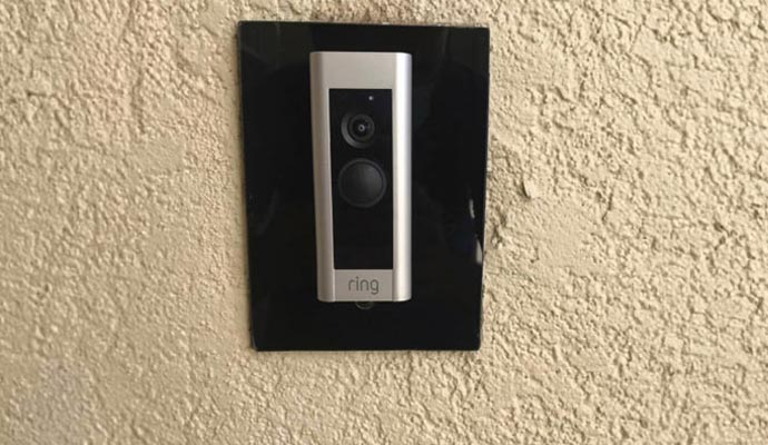 smart ring video doorbell camera mounted on the wall